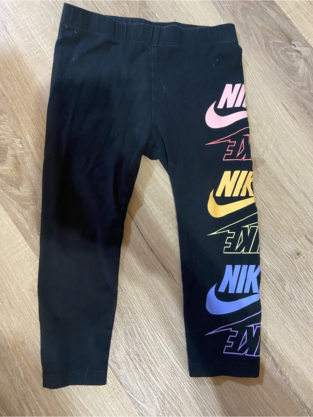 Nike Black Kids Leggings with Pink, Yellow, Blue & Purple Logos